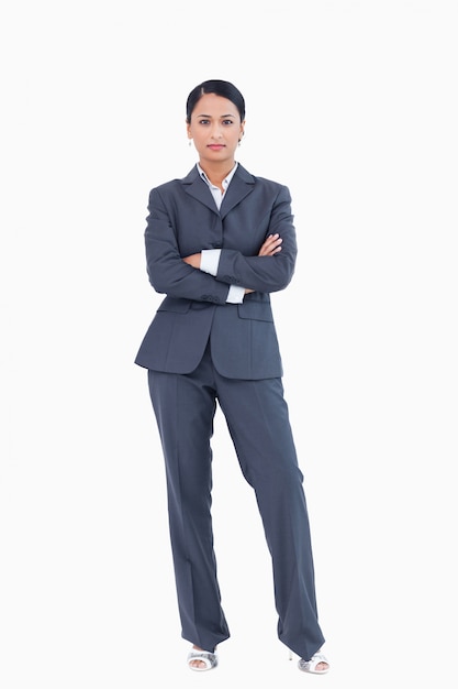 Businesswoman standing with arms folded