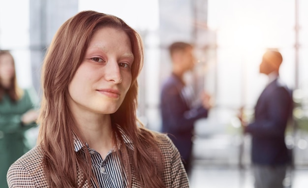 businesswoman standing with her arms crossed in an office