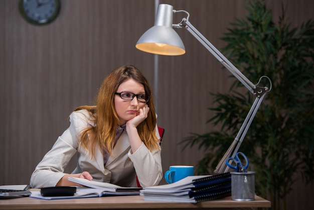 Businesswoman staying in the office for long hours