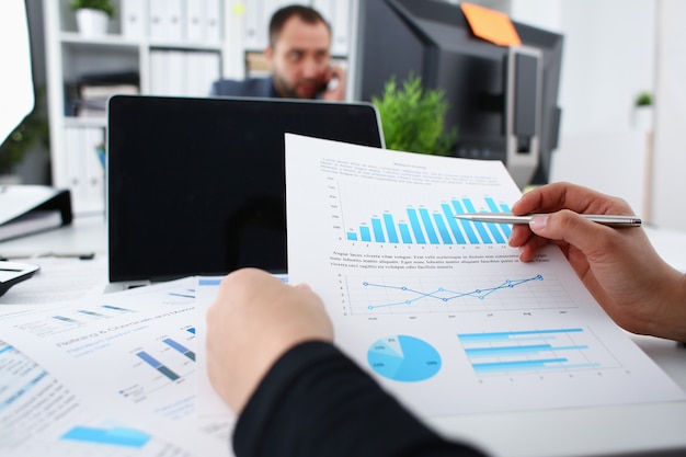 Businesswoman study documents in office closeup