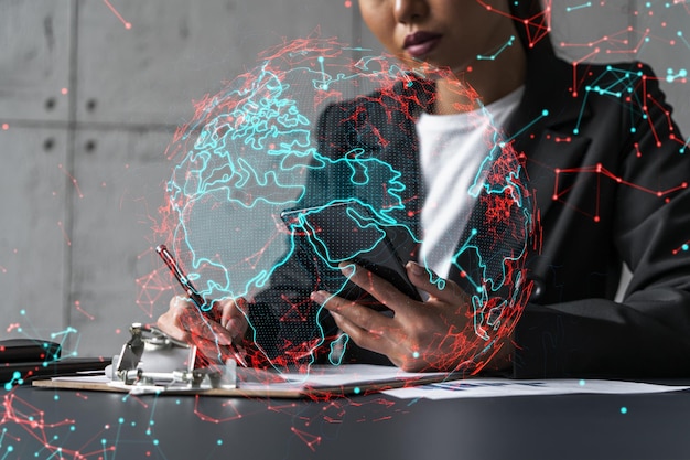 Businesswoman taking notes and world map hologram Double exposure Technology security network solution planet earth international business concept