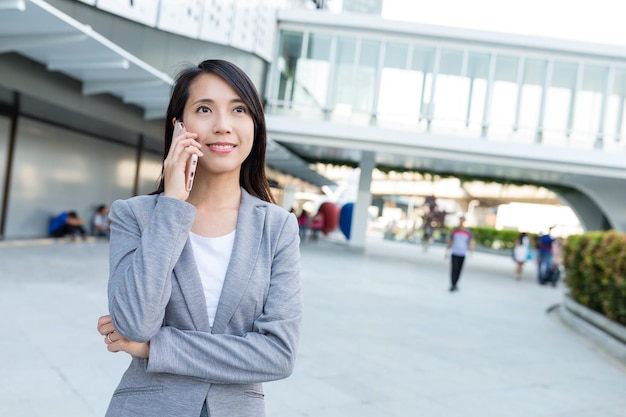 Businesswoman talk to mobile phone at outdoor