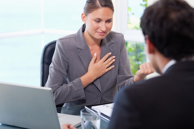 Businesswoman talking to customer