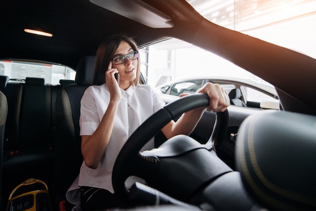 Businesswoman talking on the phone in the car