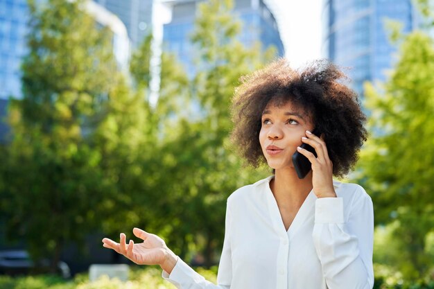 Businesswoman talking on the phone outdoors