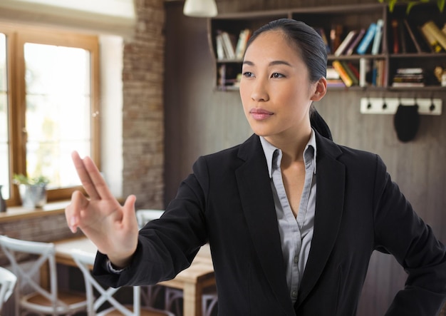 Businesswoman touching air in front of cafe