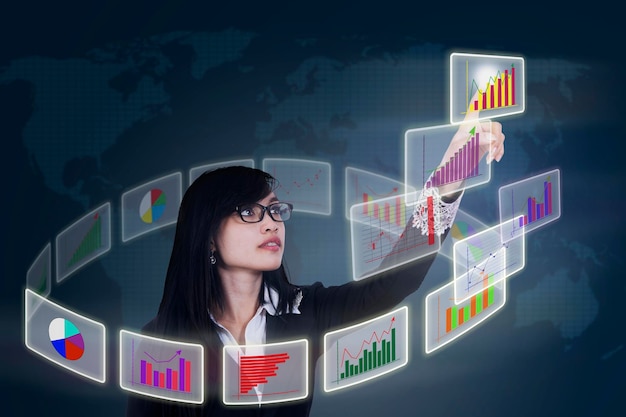 businesswoman touching business chart