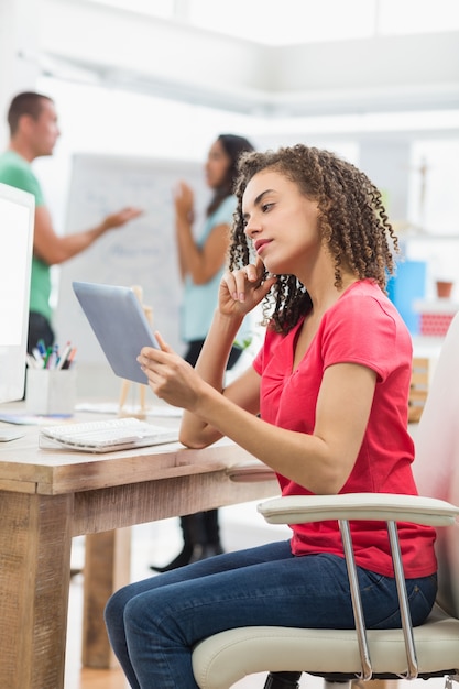 Businesswoman using a digital tablet in office