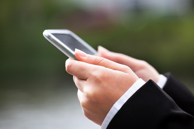 Businesswoman Using Digital Tablet Outdoors