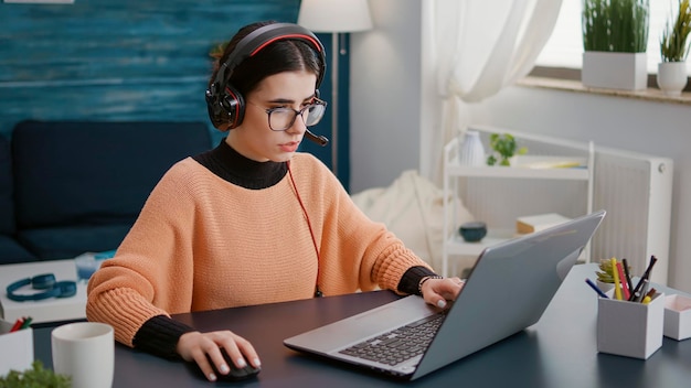 Businesswoman using laptop at office