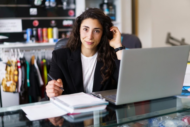 businesswoman using laptop at office