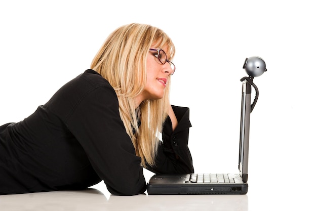 Businesswoman using laptop and webcam