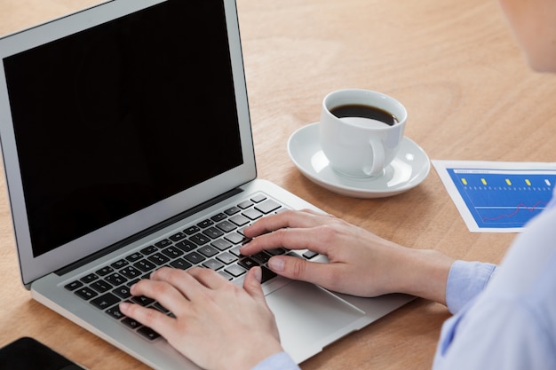 Businesswoman using laptop