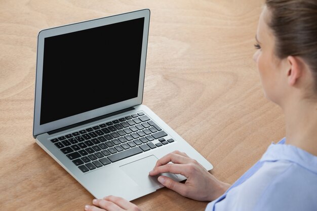 Businesswoman using laptop