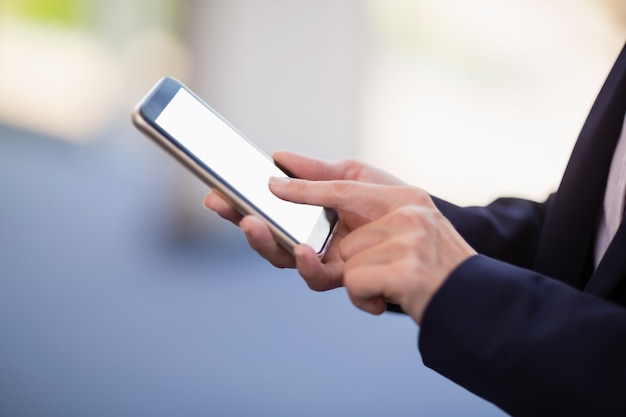 Businesswoman using mobile phone