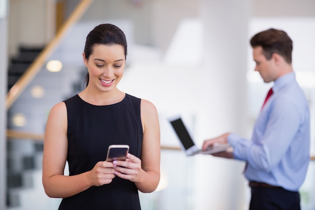 Businesswoman using mobile phone