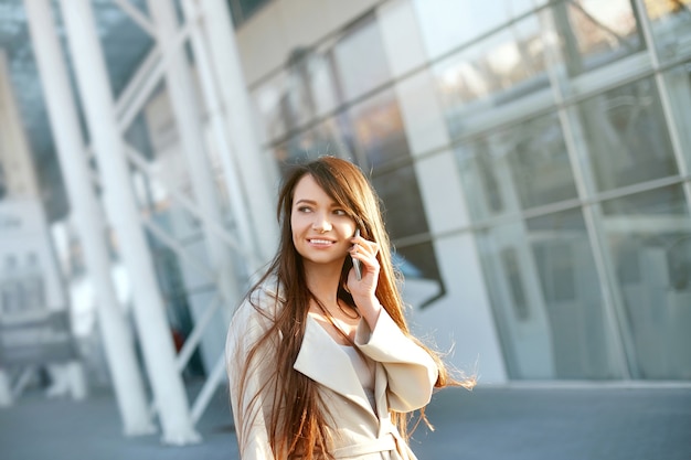 Businesswoman using a smartphone outdoors