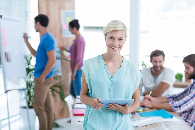 Businesswoman using tablet in the office