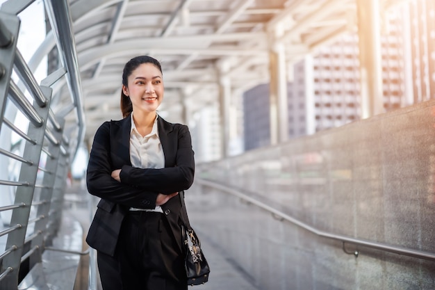 Businesswoman with arms crossed in the city