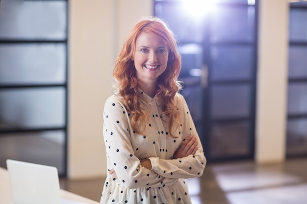 Businesswoman with arms crossed in office