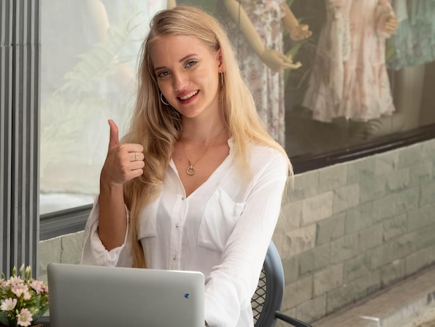 Businesswoman with blond hair europe manager in company office happy smile wear white shirt