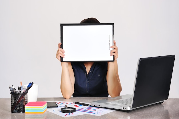 Businesswoman with clipboard