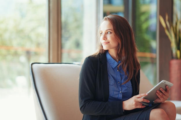 Businesswoman with Digital Tablet in Office