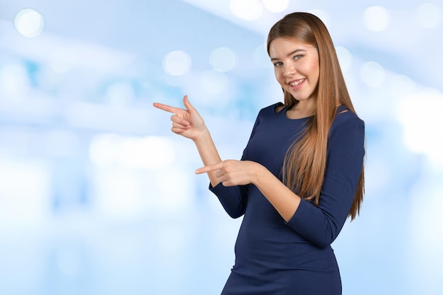 Businesswoman with finger point aside