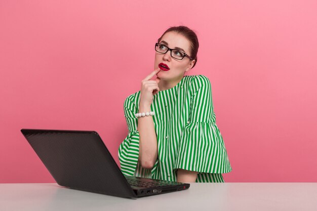 Businesswoman with hair bun and laptop