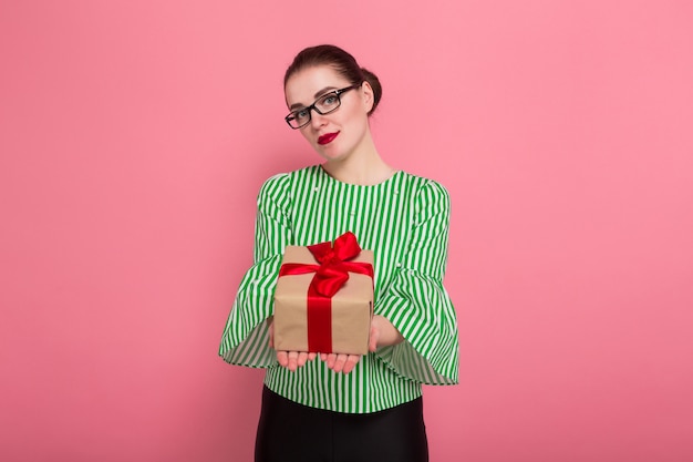 Businesswoman with hair bun and present