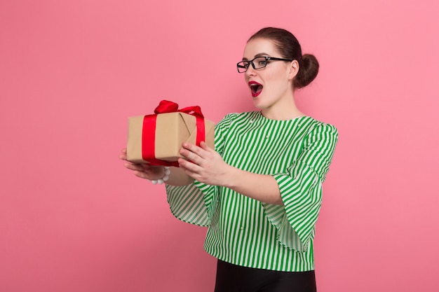 Businesswoman with hair bun and present