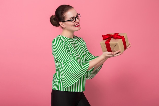 Businesswoman with hair bun and present