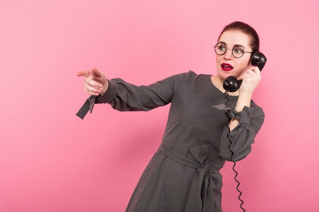Businesswoman with hair bun and telephone