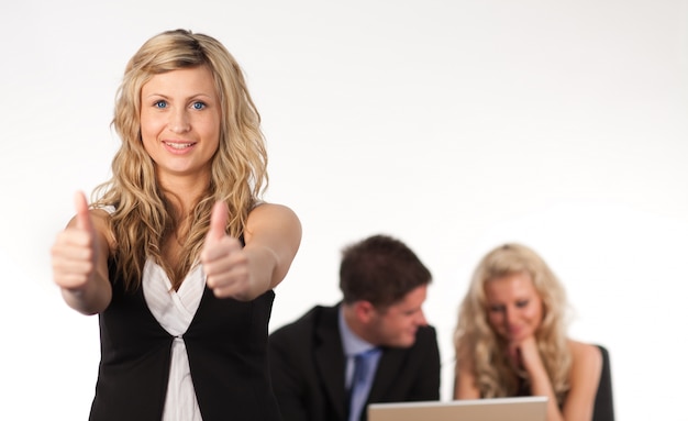 Businesswoman with her thumb up to camera