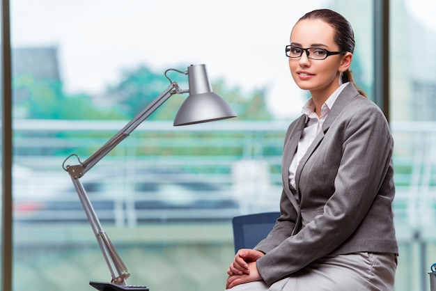 Businesswoman with laptop in business concept