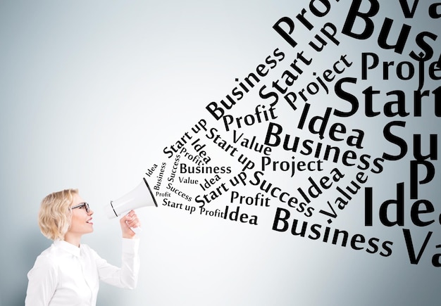 Businesswoman with loudspeaker