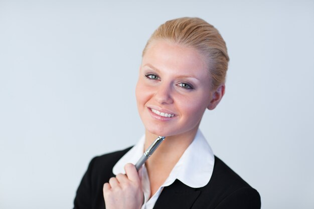 Businesswoman with pen in her hand 