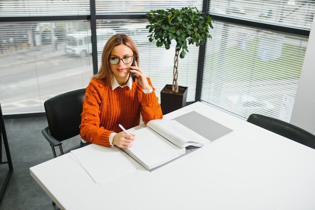 Businesswoman at work talking on phone