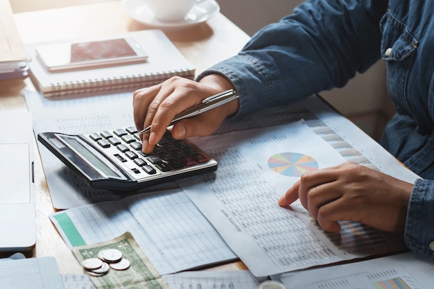 Photo businesswoman working check data of document finance in office