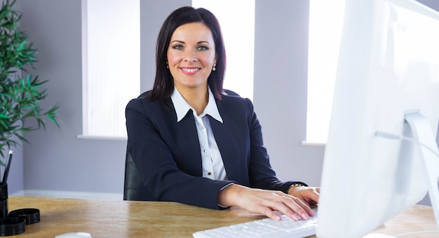 Businesswoman working at her desk