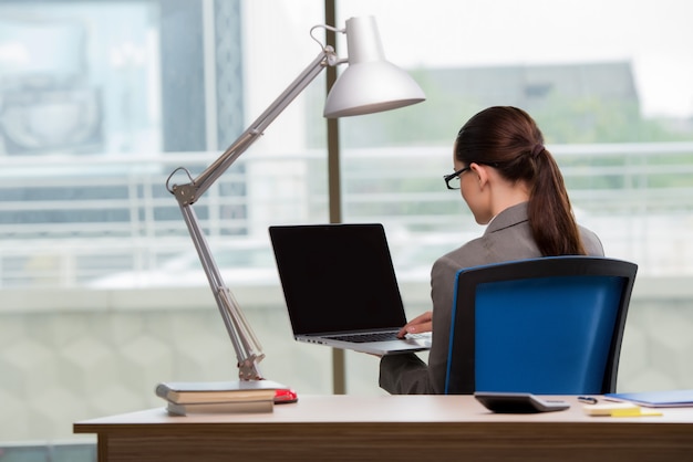 Businesswoman working at her desk