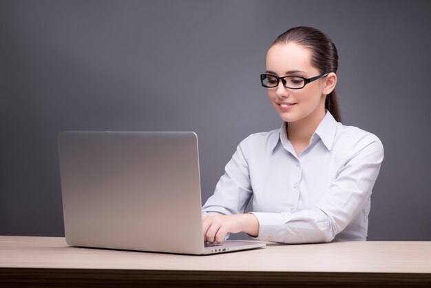 Businesswoman working at her desk 