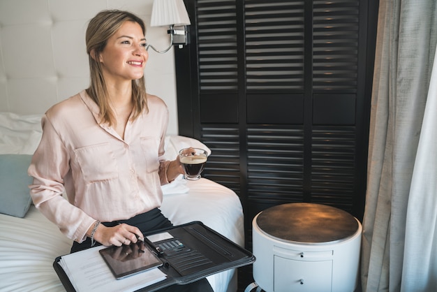 Businesswoman working on her digital tablet