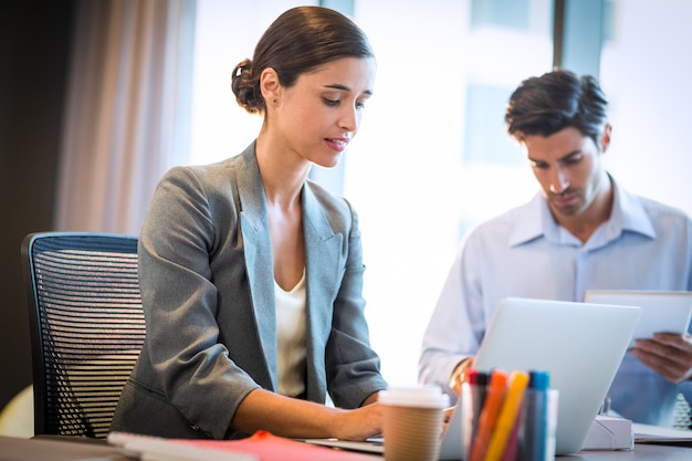 Businesswoman working on laptop