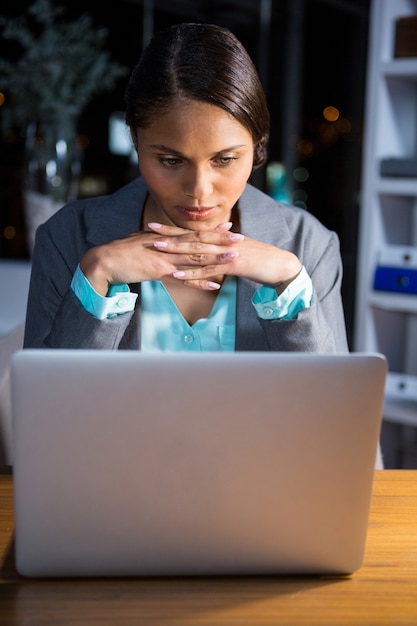 Businesswoman working on laptop