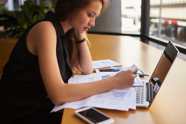 Businesswoman working in office side view close up