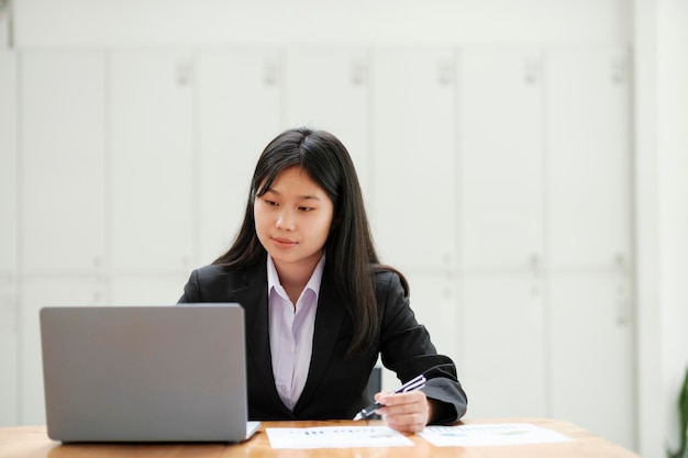 Businesswoman working at office using laptop