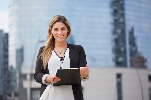 Businesswoman working outside office building