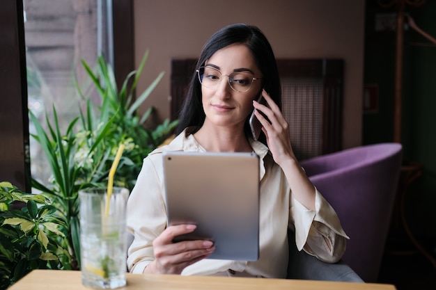 Businesswoman working on a tablet