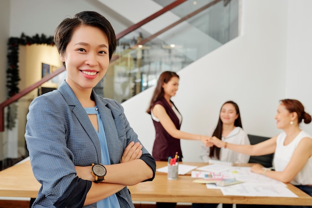 Businesswoman working with colleagues at office